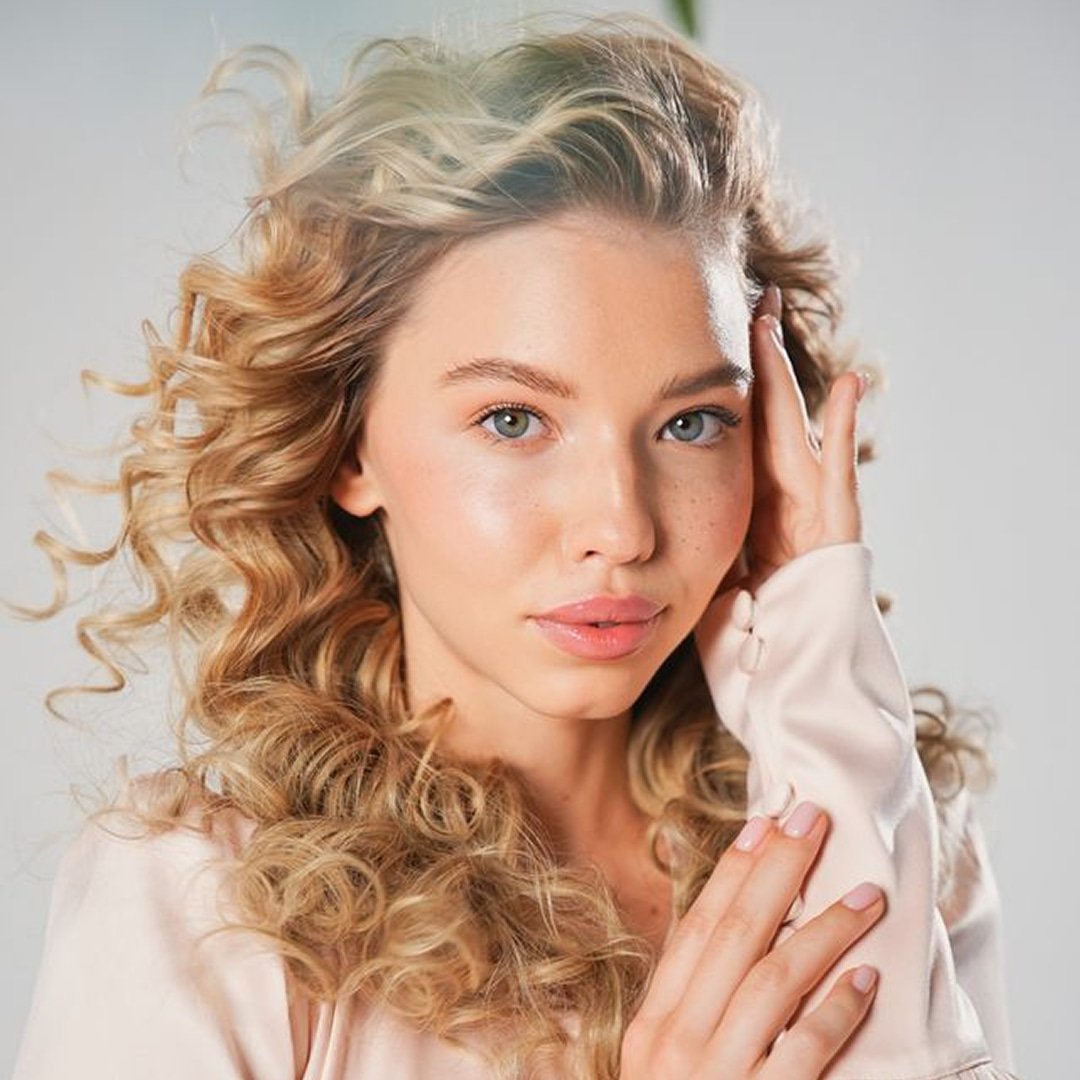 beautiful lady with curly blond hair