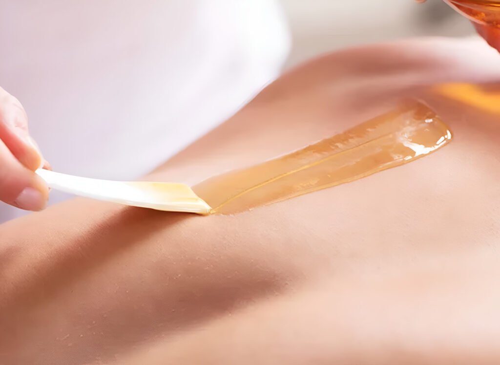 Close-up of applying warm wax