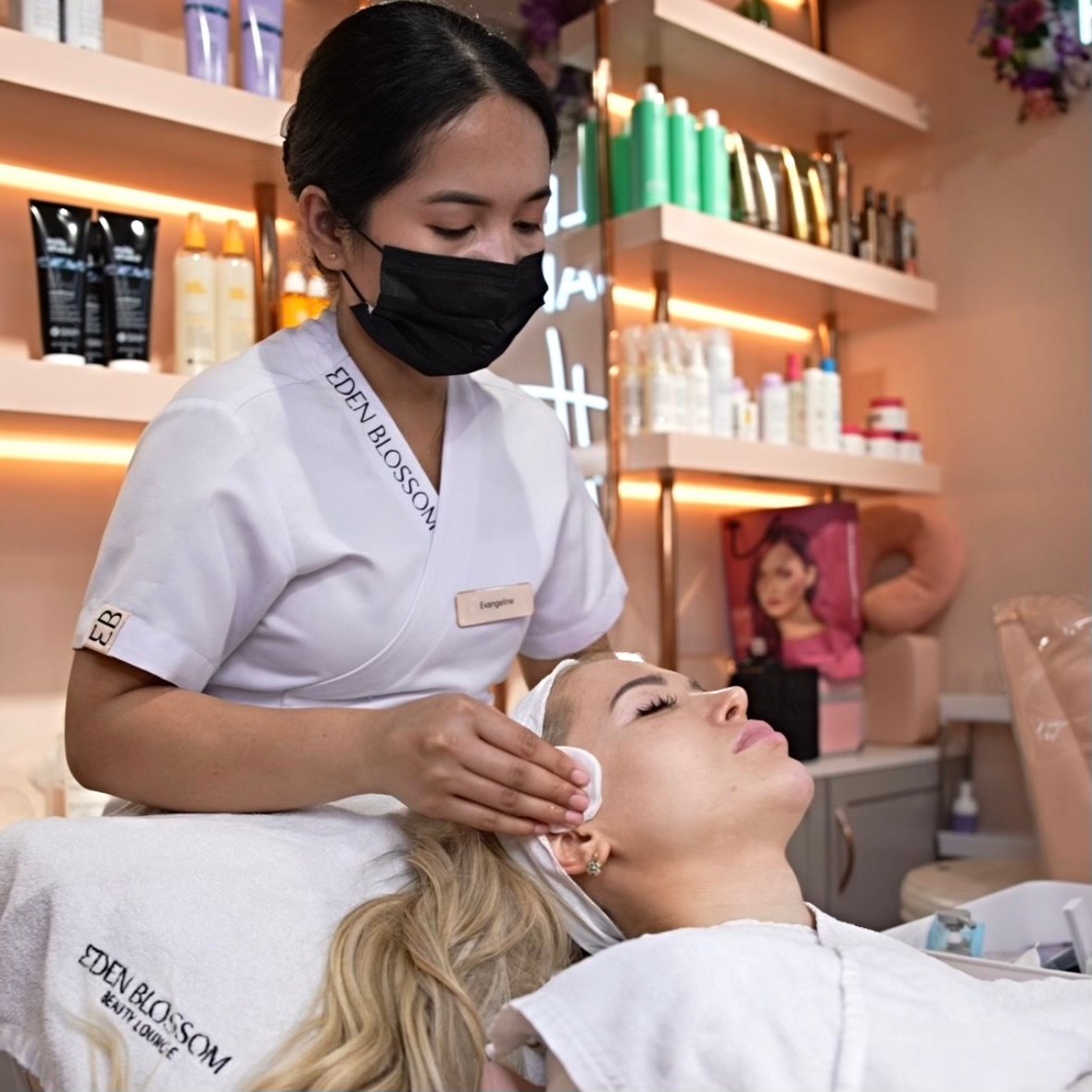Eden blossom salon lady-worker treating a female customer